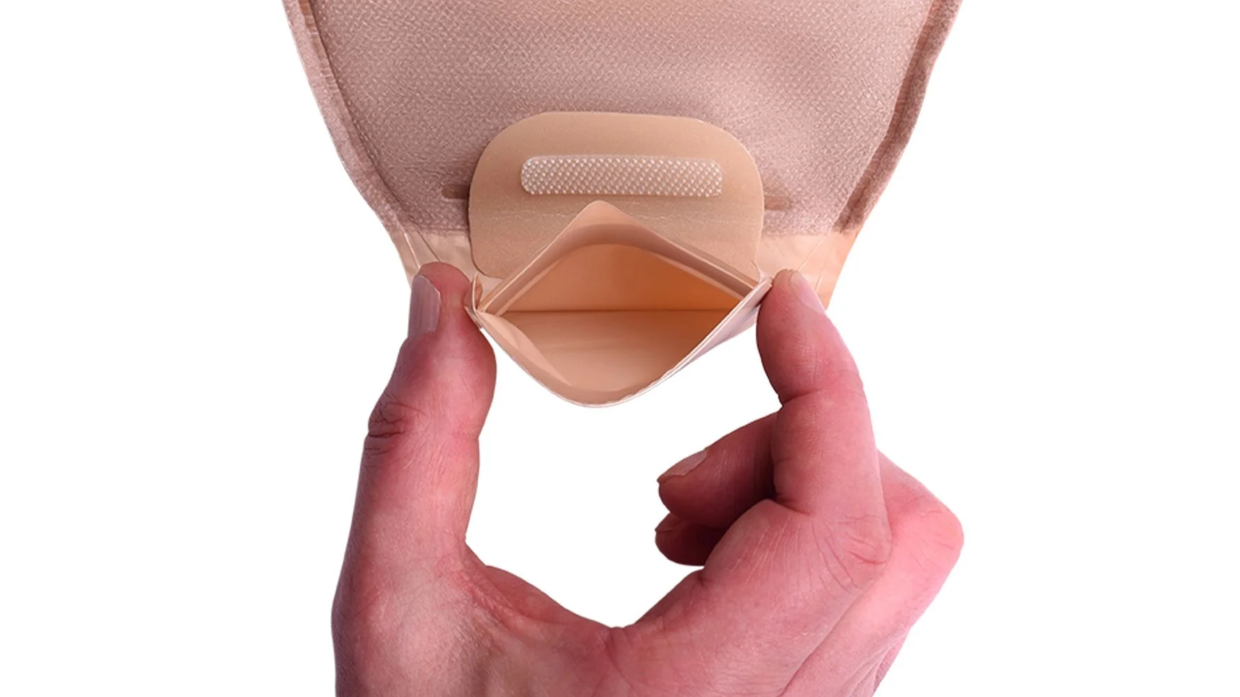 a hand holding a roll of toilet paper